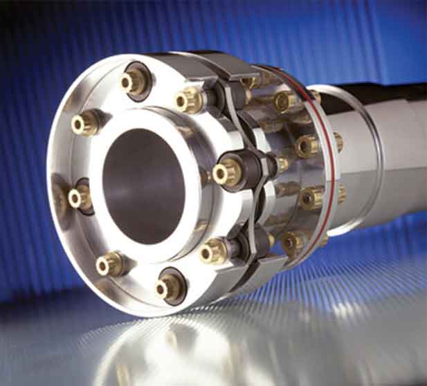 A close up of a metal wheel with a large hub