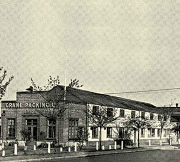 An old photo of a building with a sign on it