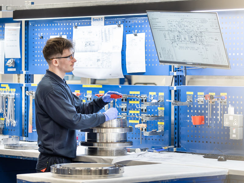 Technician Working On Compressor Seal