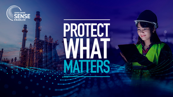 Person looking at screen with factory in background with Protect what matters text