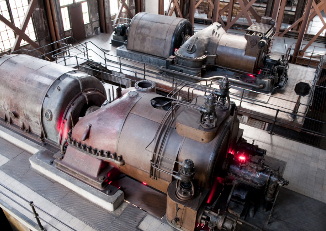 Two large steam engines in a large building